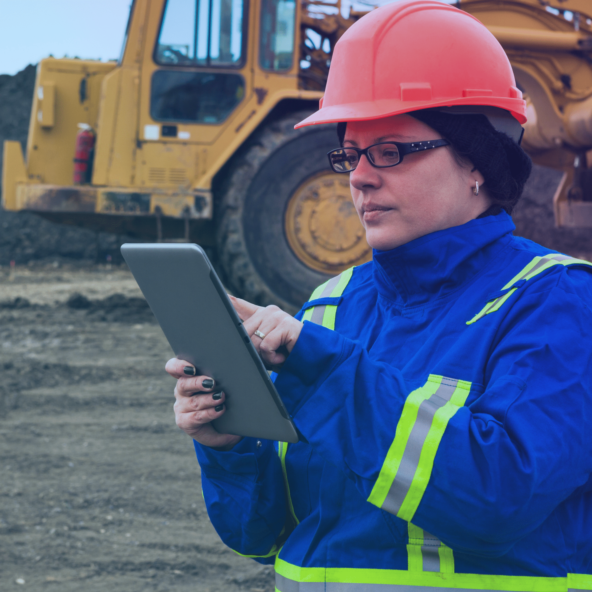 woman on a construction site with a tablet